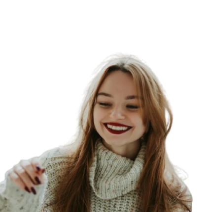 Young woman wearing a light knit sweater, looking toward the camera with a calm smile against a softly blurred neutral background