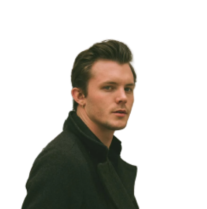 A man wearing a brown jacket